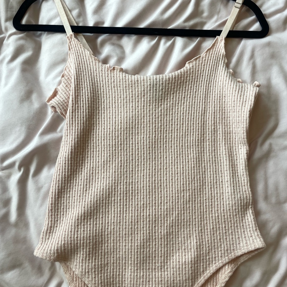 Baby pink body suit